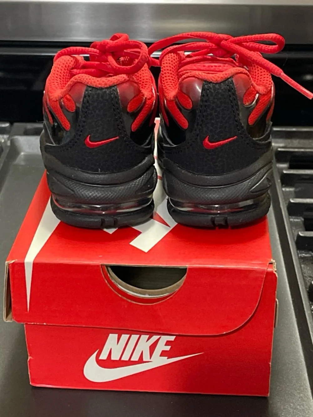 Nike Little Air Max Plus Toddler Sneakers in Red and Black